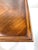 A finely crafted 1960s Lane coffee table featuring a walnut veneer top with a richly figured burl medallion, framed by a...