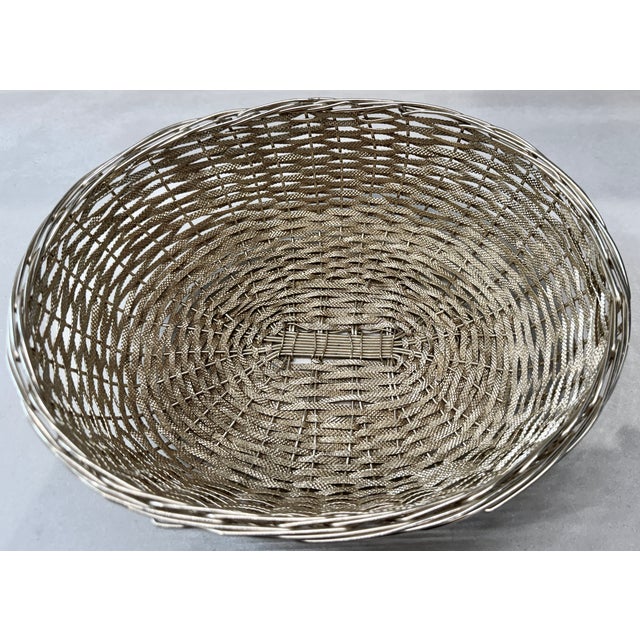 Handwoven from Silver colored wire (uncertain as to metal, since there are no hallmarks or manufacturing marks -...