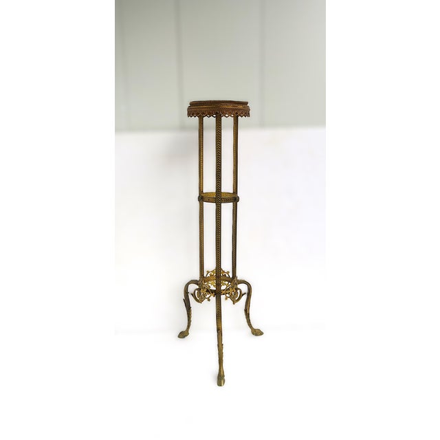 A substantial French gold gilt bronze pedestal column plant stand, in the Empire design style, circa 20th century, France....