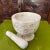 Delve into the timeless art of handcrafted pottery with a vintage marble mortar and pestle. For centuries, artisans have...