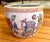 Pretty hand painted scene including fresh spring tulips, a watering can, roses and butterflies. A golden yellow pattern...