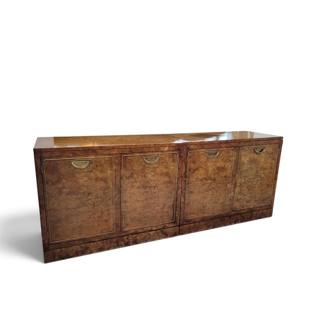 A handsome late-20th-century modular two-piece credenza by Mastercraft of Grand Rapids, executed in richly figured...