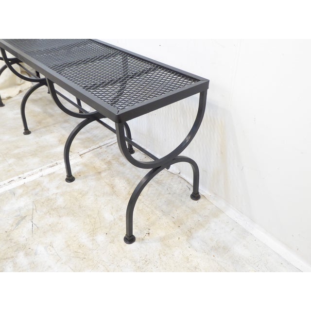 This metal bench will seat three comfortably.