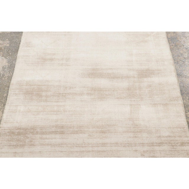 Hand-knotted in Art Silk, this 3x15 extra long runner is a sophisticated addition to Rug & Kilim’s Textural collection....