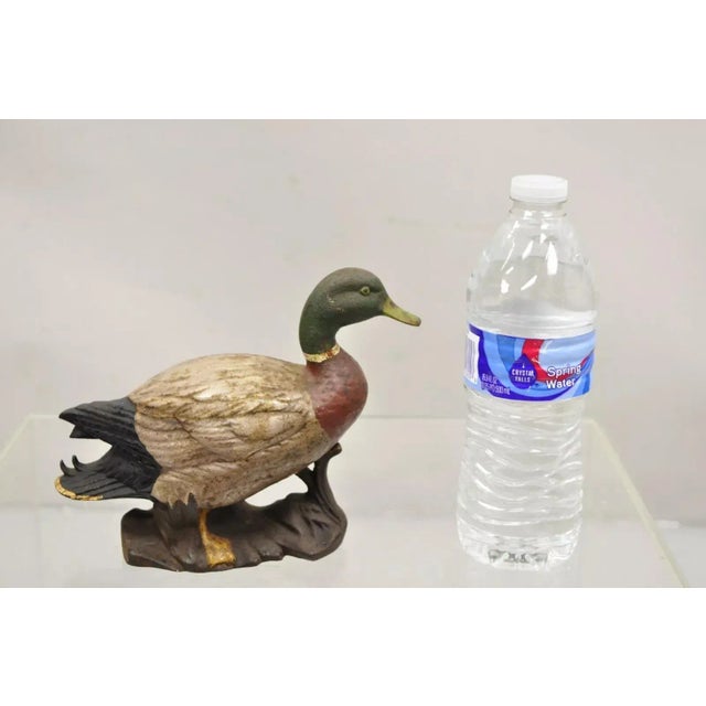 Antique Victorian Cast Iron Figural Painted Mallard Duck Door Stop. Circa Early to Mid 1900s. Measurements: 6" H x 8" W x...