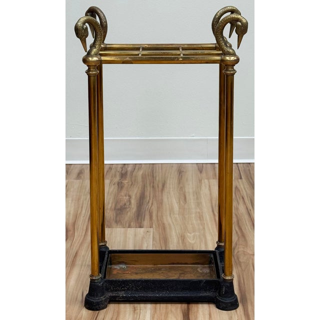 Stunning vintage brass umbrella stand featuring swan-head finials. Made by Chapman. Features sturdy construction with a...