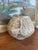 This signed handcrafted studio pottery vase features a globular form with a narrow opening and a warm, earthy glaze in...