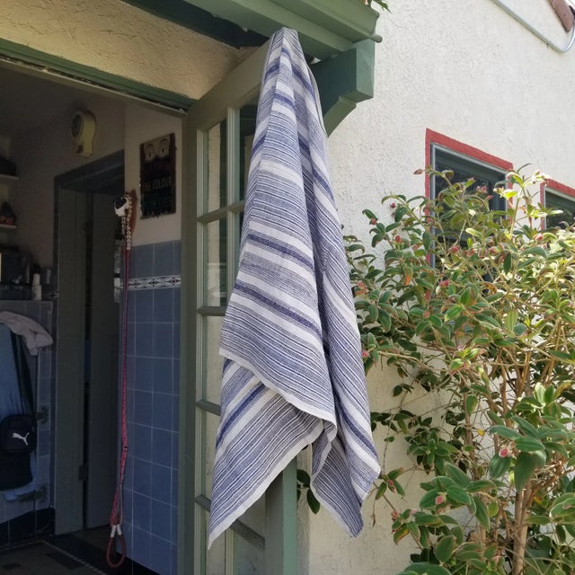 An indigo striped throw. Hand spun and woven in super soft hemp. Softly worn. This was origibnaly a hill tribe 1000 pleat...