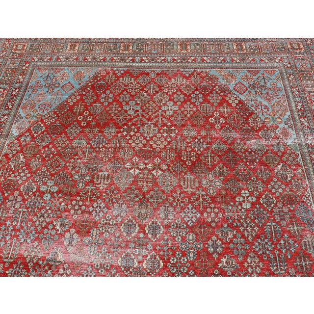 Antique Persian Joshegan rug with geometric medallion design in red and light blue, rug EMB-9613-P13524, country of origin...