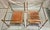A pair of gilt bronze, brass, glass, and leather side tables, French work from the second half of the 20th century,...
