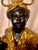 Mid to late 20th century high quality lamp features a child in stylized Eastern attire holding a staff resting on a black...