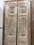 A pair of exquisite antique French doors, hand-carved with an elegant floral motif that showcases the fine craftsmanship...
