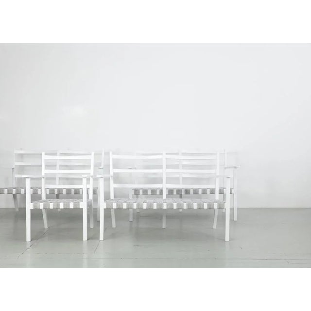 This set of three white painted wooden benches and an armchair was made in italy in the 1960s. We covered the seats with...