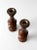 This pair of vintage wooden candleholders showcases a warm polished finish with sculptural turned forms and brass inset...