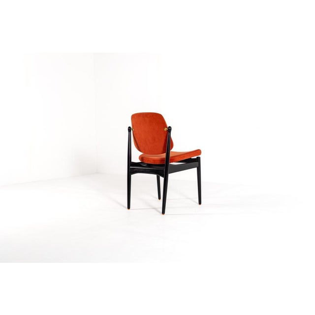 This exquisite set of five mid-century modern chairs, designed by renowned Danish architect Arne Vodder and produced by...
