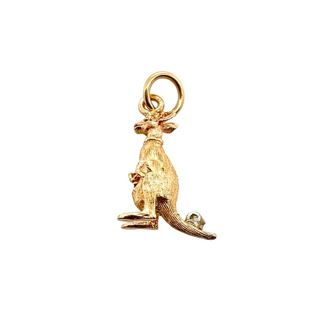 A playful vintage 14K gold charm in the form of a kangaroo, finished all around with fine detail and a sweet surprise — a...