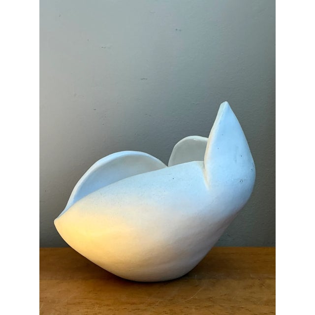 This vintage sculptural bowl is crafted from white ceramic and captures the fluid, organic lines associated with Mid-...
