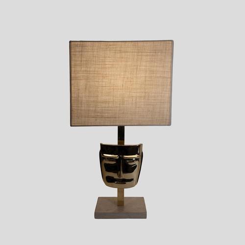 Pair of vintage Italian design table lamps, solid cast brass shaped as masks, brass stem on an off white travertine marble...