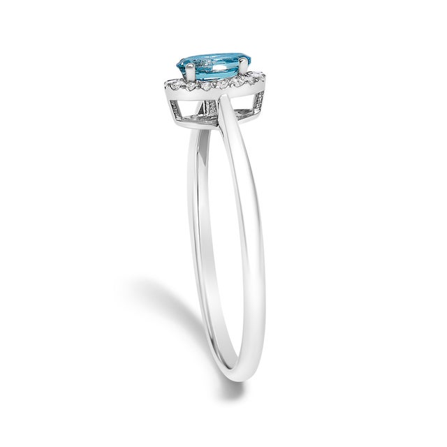 Early 21st Century 10K White Gold 5X3MM Oval Blue Topaz and Diamond Accent Halo Ring (I-J Color, I1-I2 Clarity) - Ring Size 6.5 For Sale - Image 5 of 7