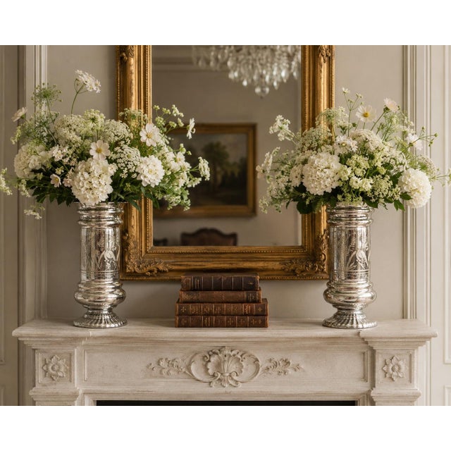 A lovely large pair of authentic antique 19th-Century hand blown mercury glass decorative vases from France. These...