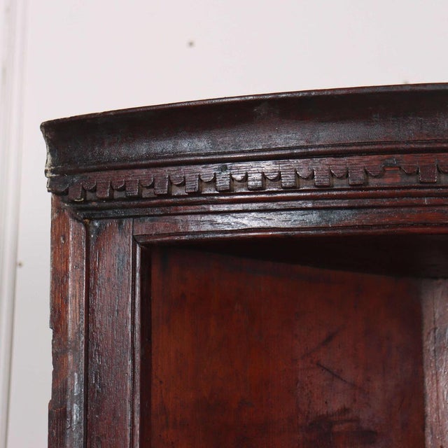 Small 18th Century English oak bowfront hanging corner cupboard. 1780 This will fit into a 17" (43cm) corner. This piece...