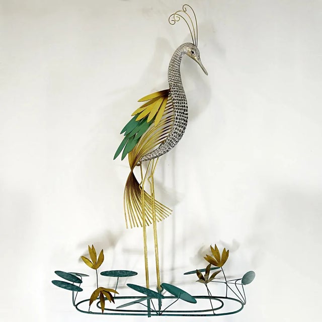 Gracious wall sculpture of a stylized silver heron or common crane designed by Curtis Jere and made by Artisan House. The...