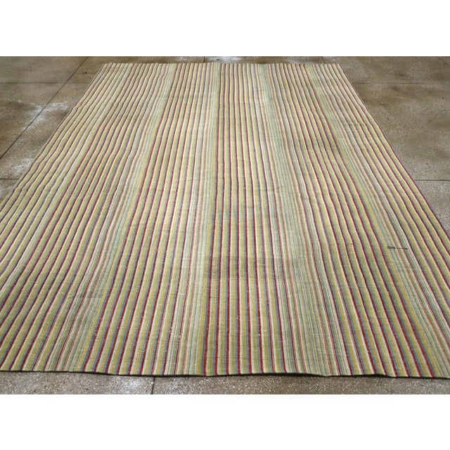 A vintage Turkish flatweave Kilim room size carpet handmade during the Mid-20th Century. Measures: 9' 2" x 12' 0".