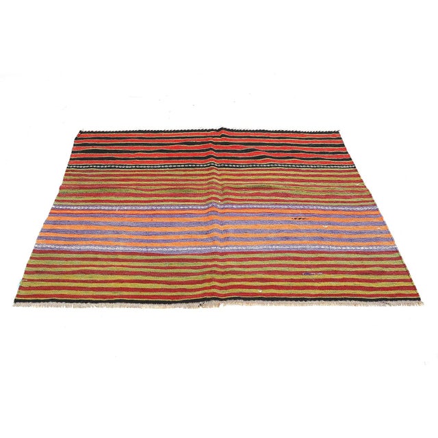 Handwoven vintage striped kilim rug from Denizli region of Turkey. Approximatelly 45-55 years old. In very good condition.