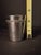 An exquisite mid-20th-century German .800 solid silver beaker or miniature Kiddush cup crafted by the renowned silver...