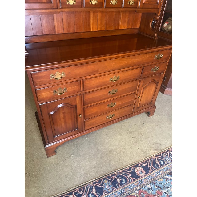 Very high quality hutch by Henkel Harris. Solid cherry construction. Fairly early tag in the top drawer. Two pieces...