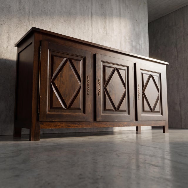 Defined by bold, multi-faceted diamond-point door panels and solid post construction, this piece delivers the unapologetic...