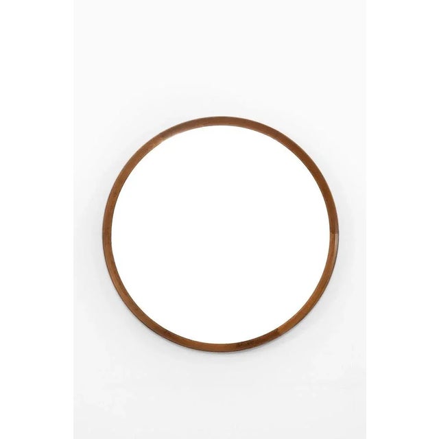 Rare Mirror in Mahogany designed by Uno & Östen Kristiansson. Produced by Luxus in Vittsjö, Sweden. Wear consistent with...