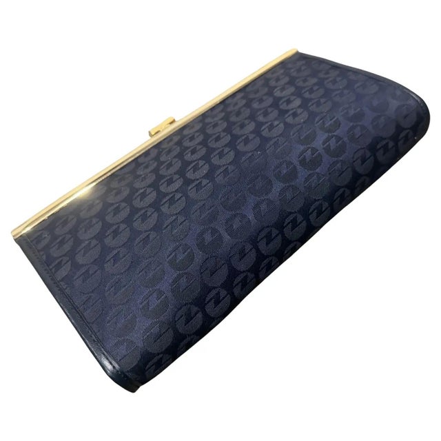 This authentic Zenith clutch is a quintessential example of 1980s Italian eveningwear, combining structured elegance with...