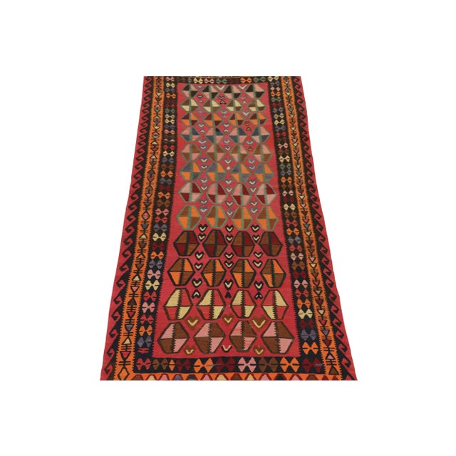 This vintage 5x11 Persian Kilim is a unique tribal rug for its period that hails from Northwest provenance. Handwoven in...