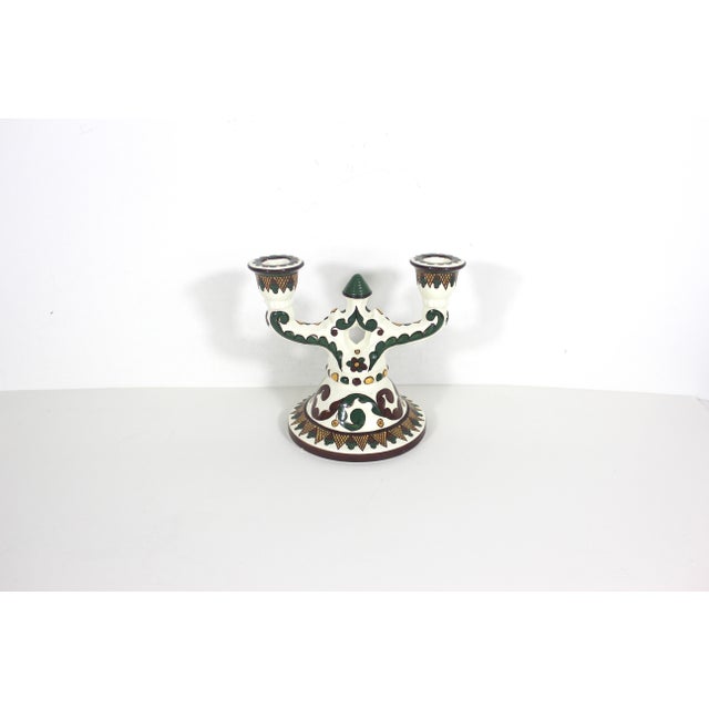Vintage Ukrainian hand painted ceramic candelabra. The base is creamy white glaze with hand painted green, yellow and...