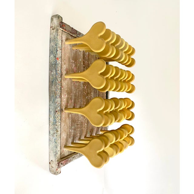 A unique piece of industrial salvage with giant yellow hearts, this sculptural vintage balloon mold with plastic pegs...
