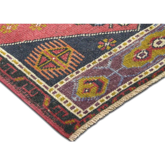 Hand-woven wool yastic from Western Turkey's Oushak region, measuring 2' x 3'8". This vintage textile showcases the...