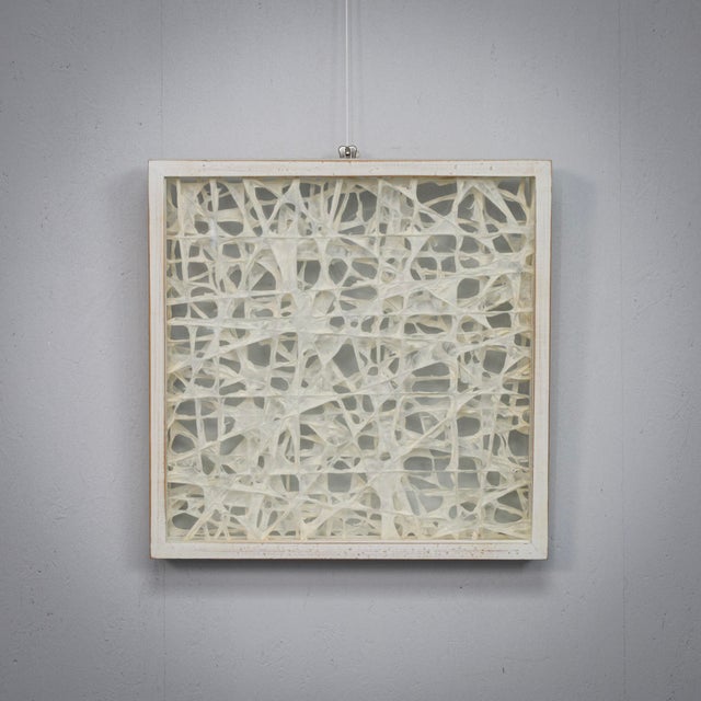 n intriguing wall-mounted sculptural composition from the 1990s, combining organic fiber structures with a strict...