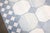 a large early 20th Century Indian Dhurrie rug in creams and light blue. some hints yellow. some minor spot stains which is...