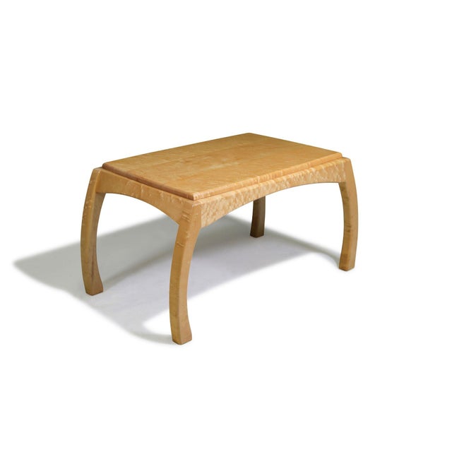 Studio coffee or side table, finely handcrafted of solid bird’s-eye maple with beautifully figured grain throughout. The...
