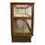An impressive antique country store display cabinet crafted from oak and glass, dating to approximately 1920. This...