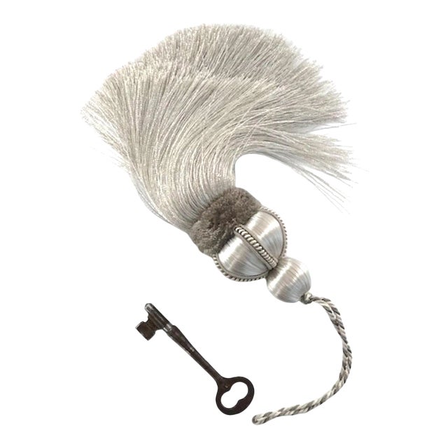 Silver key tassel with hand-cut, gray velvet ruche, decorative gimp and tri-color loop cord. Please note: Vintage key is...