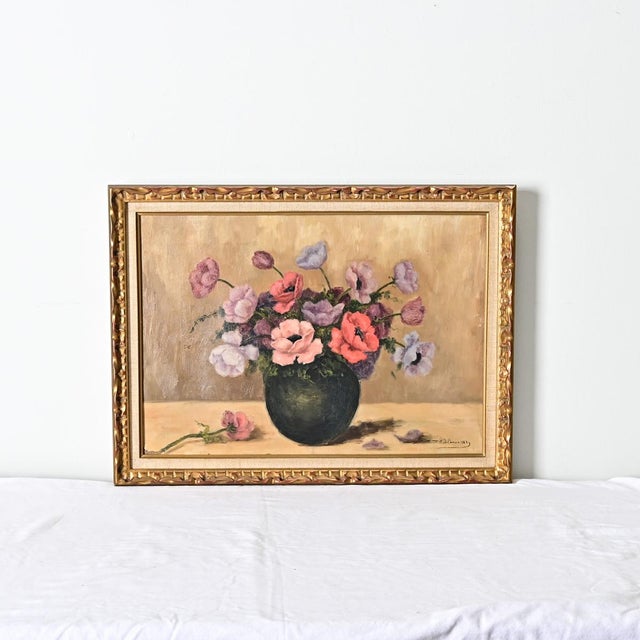 French vintage framed oil on canvas still-life painting of anemones or poppies in a round black vase. In the foreground...