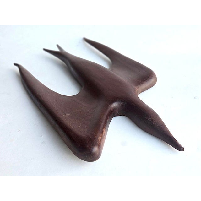 Offered is a very sleek hand-carved wall sculpture of a Falcon in flight attributed to Arthur Umanoff for Raymor. It...