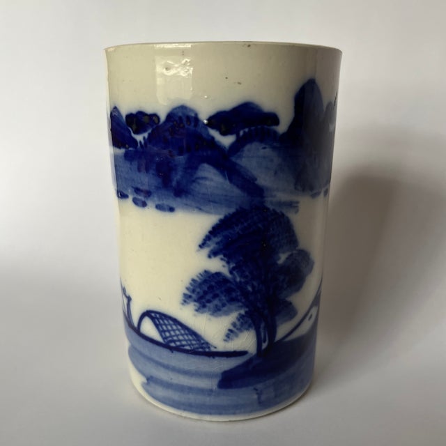 A single round antique Chinese porcelain brush cup featuring hand painted cobalt blue landscape decoration.