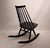 Mademoiselle rocking chair designed by Ilmari Tapiovaara in 1956 for Artek. The chair is of lacquered black birch and is...