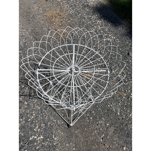 An intricately-woven designed wire planter from the 19th century, probably French or English with an overhanging scalloped...
