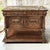 Richly carved in walnut and crowned with a beautifully veined marble top, this antique French buffet embodies the...