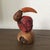 This unique folk art toucan sculpture is hand crafted from tagua nuts with the seed skin left intact, creating a beautiful...