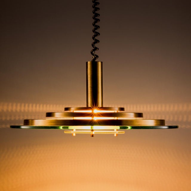 Like many cool things, this pendant lamp from the german company hillebrand dates back to the 1970s. it thrives on its...